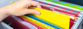 hand picking file folder